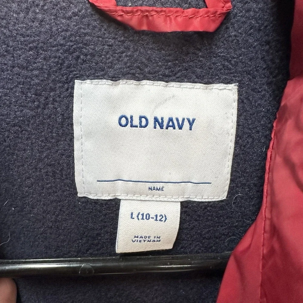 Old Navy Water-Resistant Puffer Vest Youth L Red with blue fleece‎ lining.